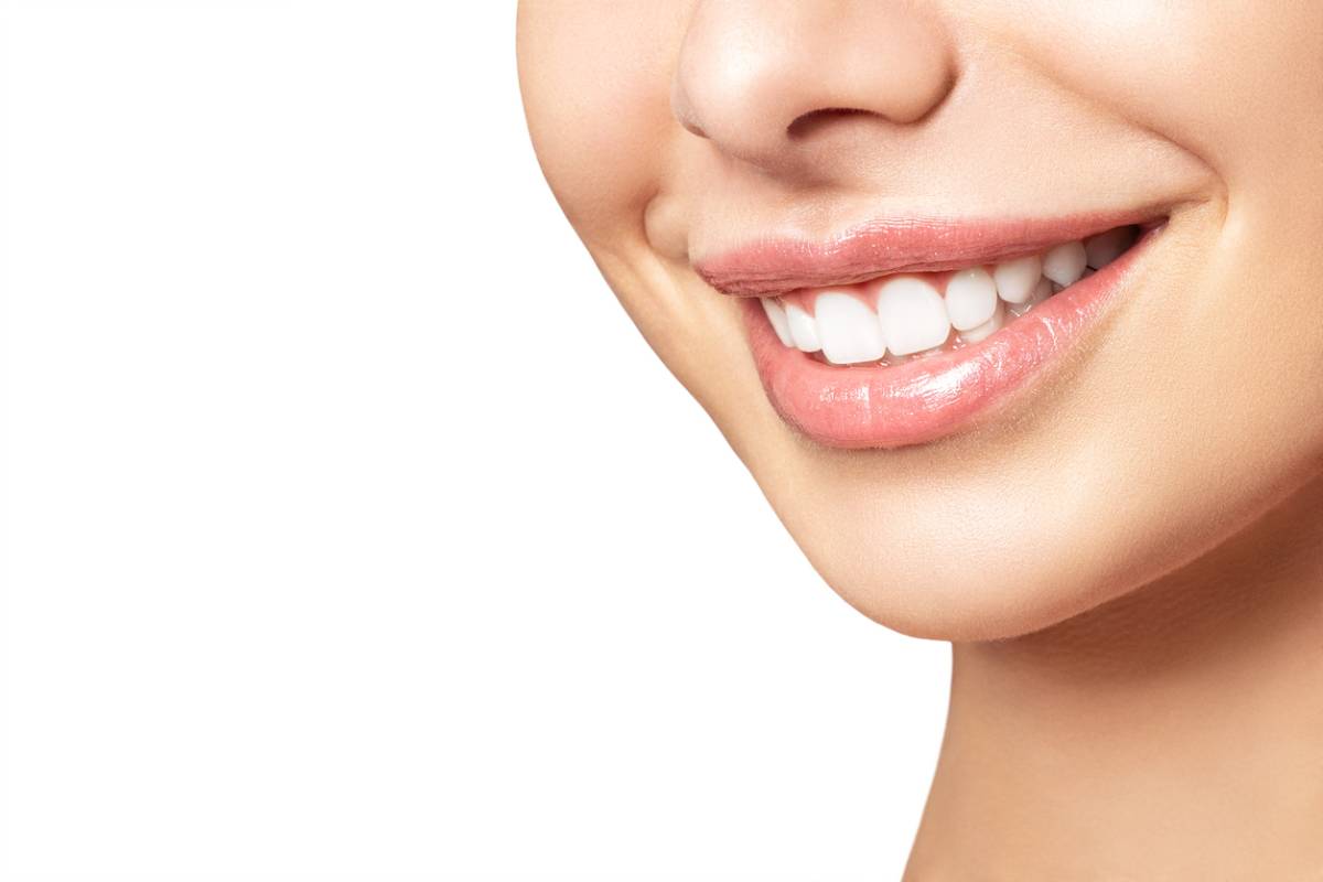 A close-up view of a person's mouth showcasing a noticeable gap where a tooth is missing.